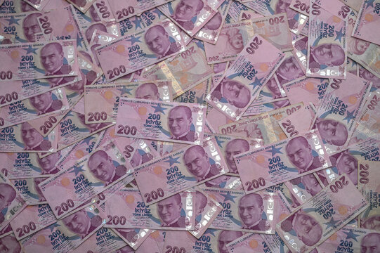 Colorful banknotes spread out, creating a vibrant pattern of currency 
