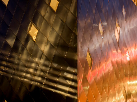 Abstract close-up, showing the diamond-patterned zinc and steel exterior panels in two contrasting lighting conditions.