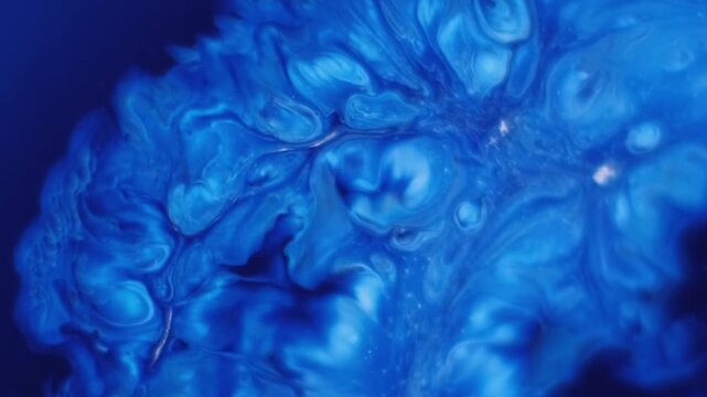 Dissolving ink. Acrylic spill. Boiling blue white enamel mixing abstract background. Blur color art steam blend dye splash effect.