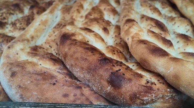Fresh bread displayed in a bakery case in the morning