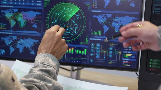 Military Officers Analyzing Tactical Map and Radar Display Monitors in Command Center