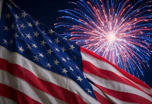 American Flag Waving With Fireworks Display Against Night Sky