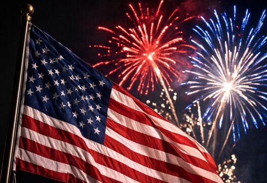 American Flag Waving Under Colorful Fireworks Display At Night
