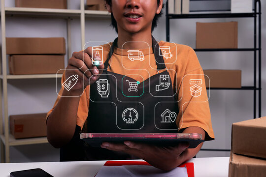 Male Pointing with Stylus Pen at Commercial Sales Interface Icons while Holding Tablet