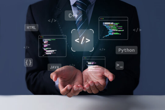 Businessman Cupping Hands Beneath Holographic Programming Coding Windows