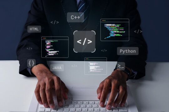 Business Person Typing on Laptop Showing Hologram Programming Code