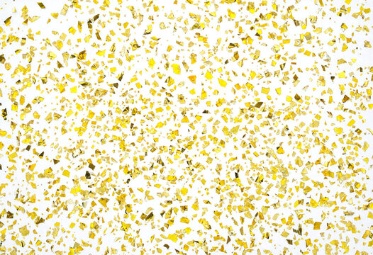 Golden confetti pieces scattered on transparent background for creative design use