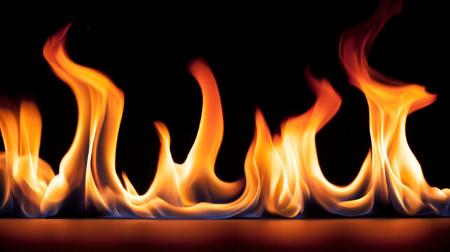 Bright yellow and orange flames rising up along a black background