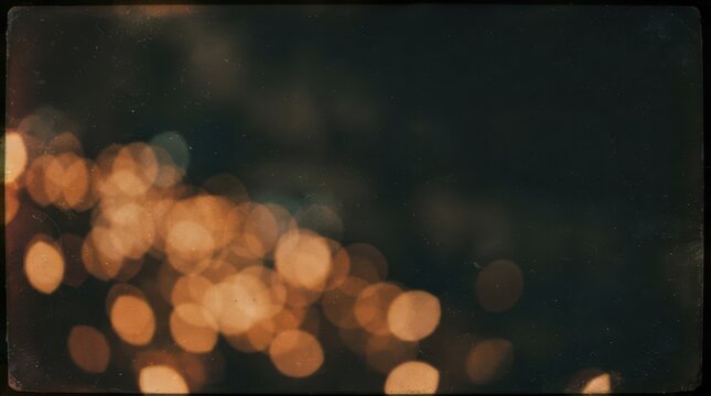 Abstract film light leak overlay with golden bokeh circles on a dark vintage textured background
