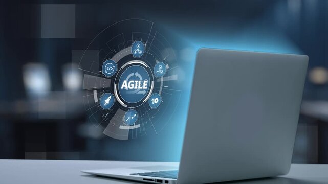 showcases a modern laptop displaying agile methodology visuals, emphasizing project management and innovative solutions within a professional workspace. Salient