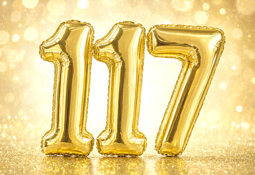 Golden foil balloons displaying the year one thousand one hundred seventeen