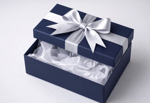 Open gift box with white ribbon bow inside showing wrapped item