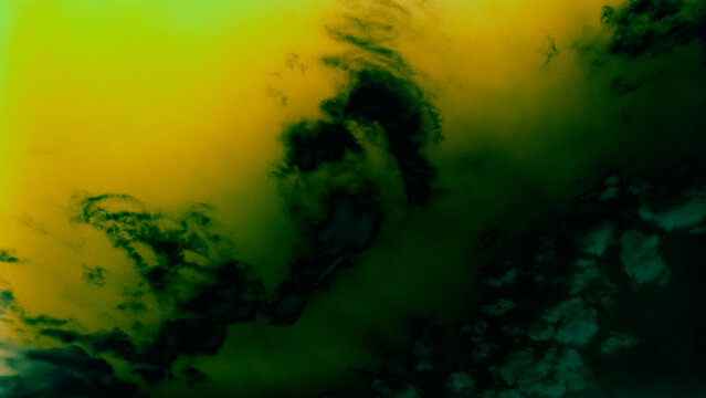 Abstract surreal sky with dark green black clouds against bright yellow lime green gradient background with smoky ethereal texture.