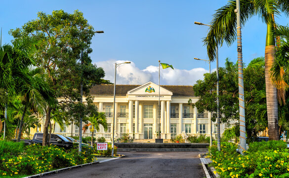 The State House, the residence of the president of Dominica surrounded by tropical trees in the capital city of Roseau