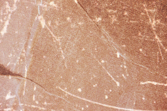 Orange old paper background with crumpled effect