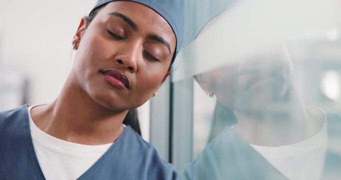 Tired, woman or surgeon with stress on glass window for medical failure, mistake or bad procedure. Exhausted, female person or nurse with reflection or fatigue for surgical crisis or loss in hospital