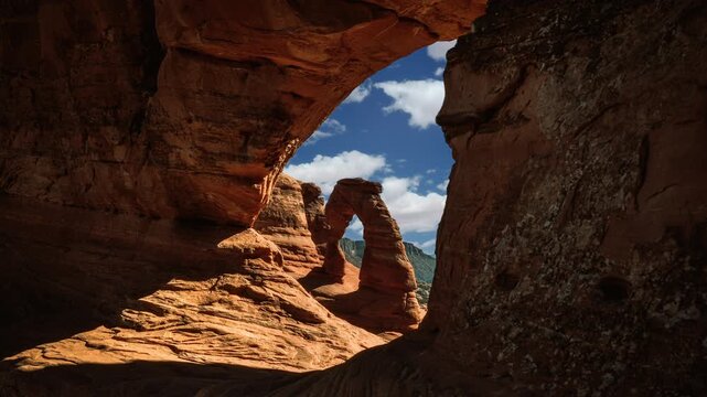 Arches National Park landscape, Utah, USA. Delicate Arch cloud sky time lapse video loop cinemagraph