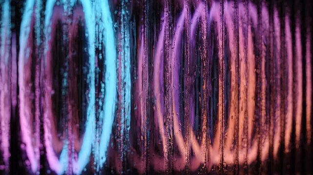 Colorful futuristic neon circles through textured glass. Luminous rings slowly rotating and distorted by ribbed glass for creative projects
