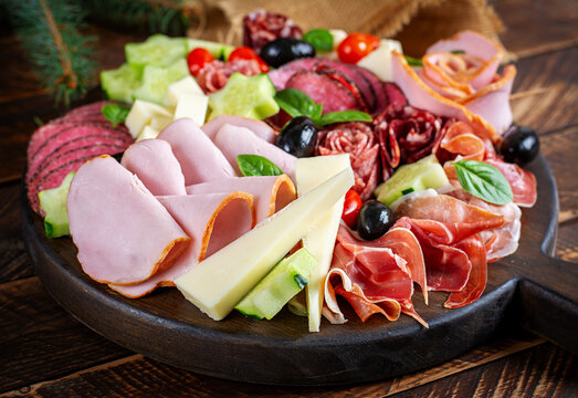 Festive Meat and Cheese Platter on Rustic Wooden Table