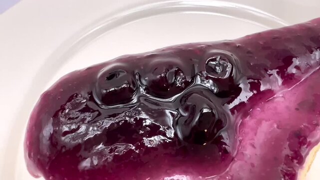 Close Up of Blueberry Topped Cake Dessert on White Plate