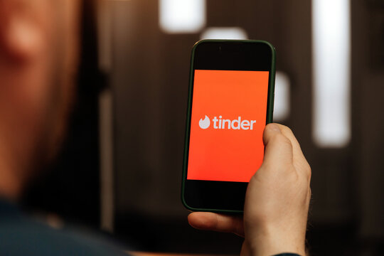 iPhone display with Tinder dating app