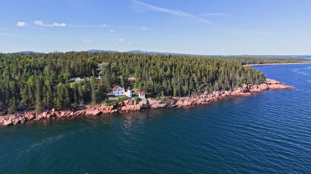 Aerial orbit of Bass Harbor Head Lighthouse in Acadia Maine