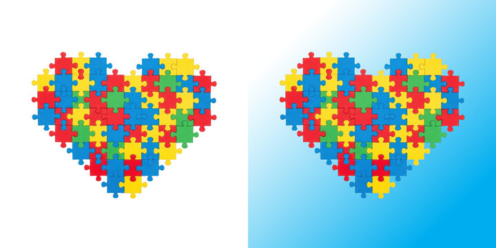 Colorful heart shape made of jigsaw puzzle pieces isolated on a clean white background