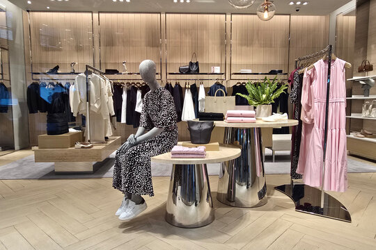 Penang, Malaysia - Sep 06, 2026: Interior view of a Boss luxury fashion boutique showcasing a stylish women's clothing, handbags and accessories inside a shopping mall.