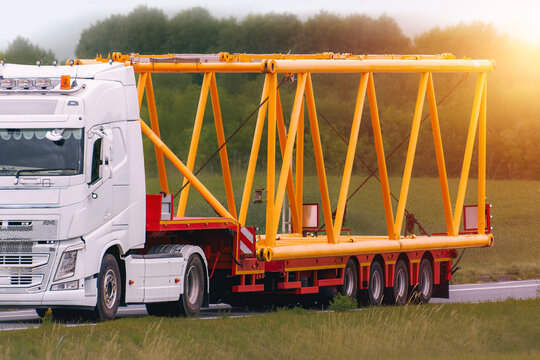 Heavy duty truck moving construction material outdoors