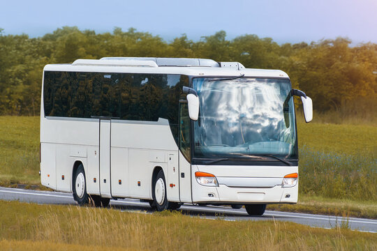 Intercity travel bus crossing countryside landscape