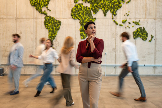 Thoughtful woman planning global business strategy