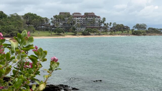 Coastal View of Tropical Resort Hotel Across the Ocean Bay