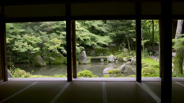 Temple grounds in Japan with pond and tatami floor