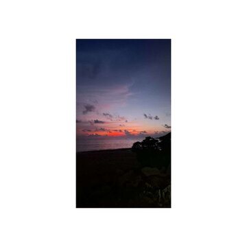 Beautiful Tropical Beach Sunset with Colorful Sky and Ocean