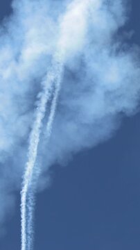 Aerobatic Stunt Plane Diving Downward Leaving Thick White Smoke Trail