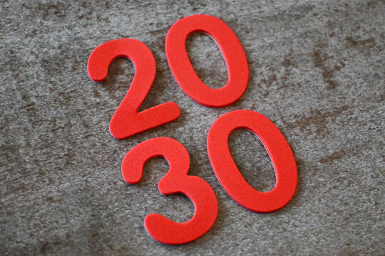Red 2030 numerals on a textured gray surface