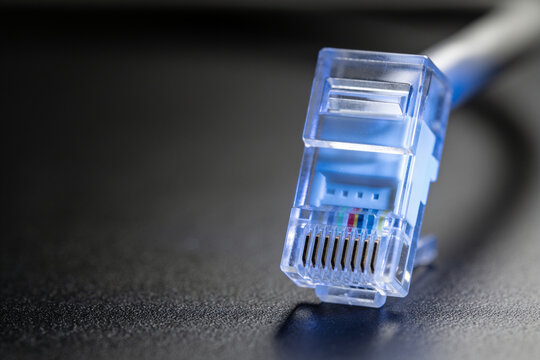 Macro of Ethernet Network Plug with Blue Glow