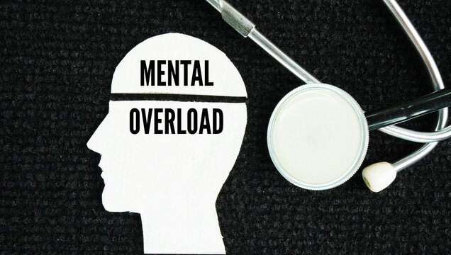 Stethoscope and head shape with the word Mental overload happens when the amount of information or tasks you experience goes beyond what your brain can process at one time.