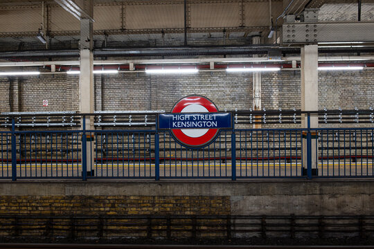 London, England, United Kingdom, August 16, 2026. High Street Kensington Underground Station roundel sign on platform barrier