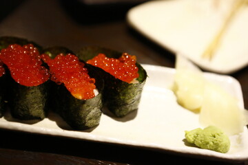 Fresh ikura salmon roe gunkan maki sushi served in Japanese restaurant. © eric1207cvb