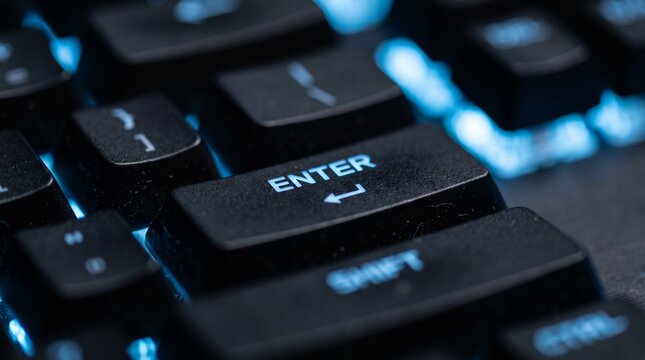 Close up of a backlit mechanical gaming keyboard with an enter key.