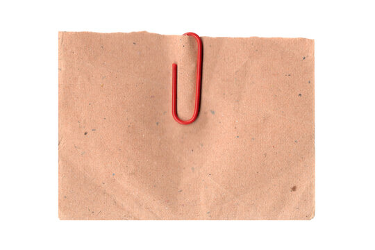 Red paper clip on brown paper isolated on white isolated on transparent background