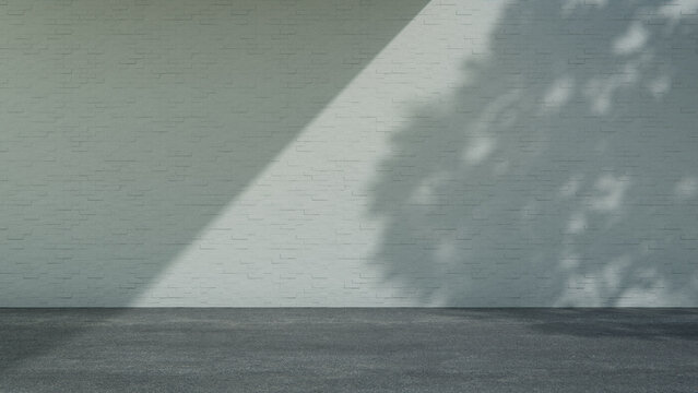 Grey Painted Brick Wall Location with Empty Asphalt Floor, Strong Daylight and Deep Shade. Product Presentation Concept with copy-space.