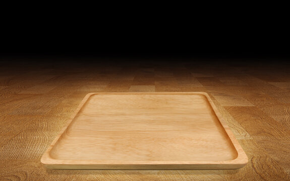 Empty wooden plate on wood background with copy space.