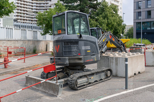 Nancy, France - July 25th 2026 : View on a grey compact crawler excavator Wacker Neuson EZ36 for earthworks on a construction site.