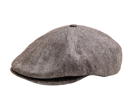 Stylish brown herringbone tweed flat cap, a classic accessory with a small brim, captured in a studio shot on a clean white background