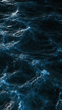 Dark ocean currents forming textured blue water patterns