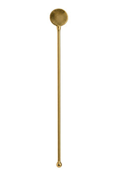 Single elegant golden metal cocktail stirrer with a flat circular top and a small ball end, isolated on a clean white background