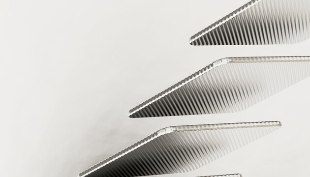 Close-up of parallel metallic triangular objects with textured