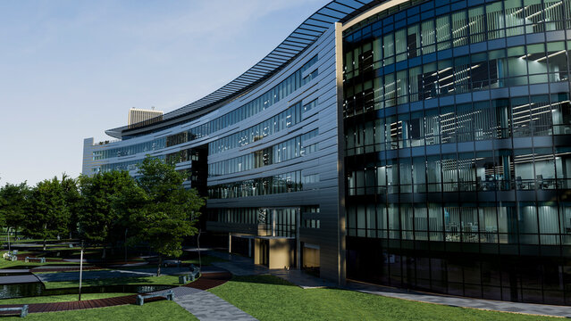 Modern curved office building with glass facade and surrounding green